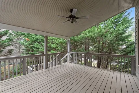 a view of a balcony with wooden floor