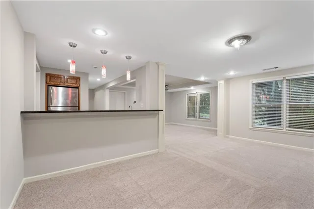 a view of an empty room with a window