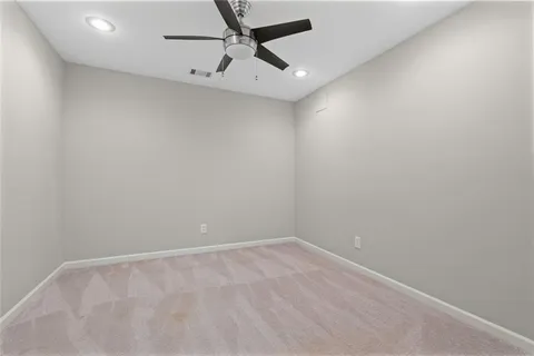 a view of a house with backyard and deck