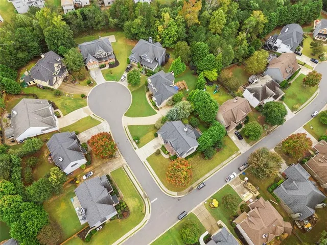 an aerial view of a house with yard swimming pool and outdoor seating