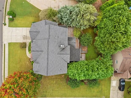 a aerial view of a house with a yard