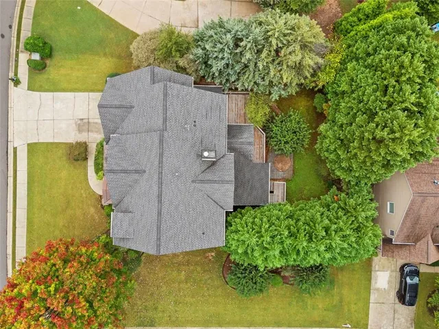 a aerial view of a house with a yard
