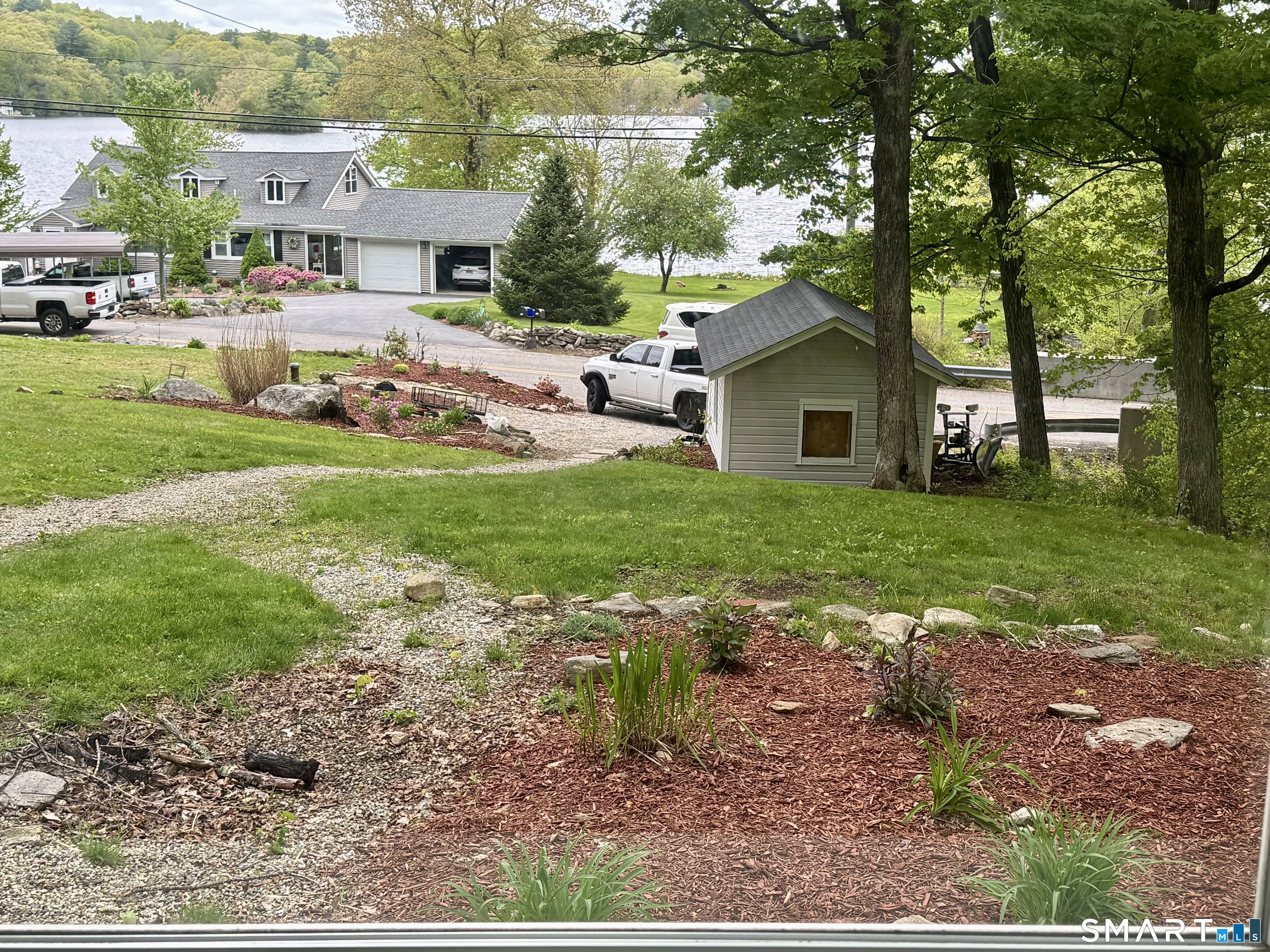 277 Lake Road Andover, CT 06232 - Photo 2 of 18 a view of a house with a yard