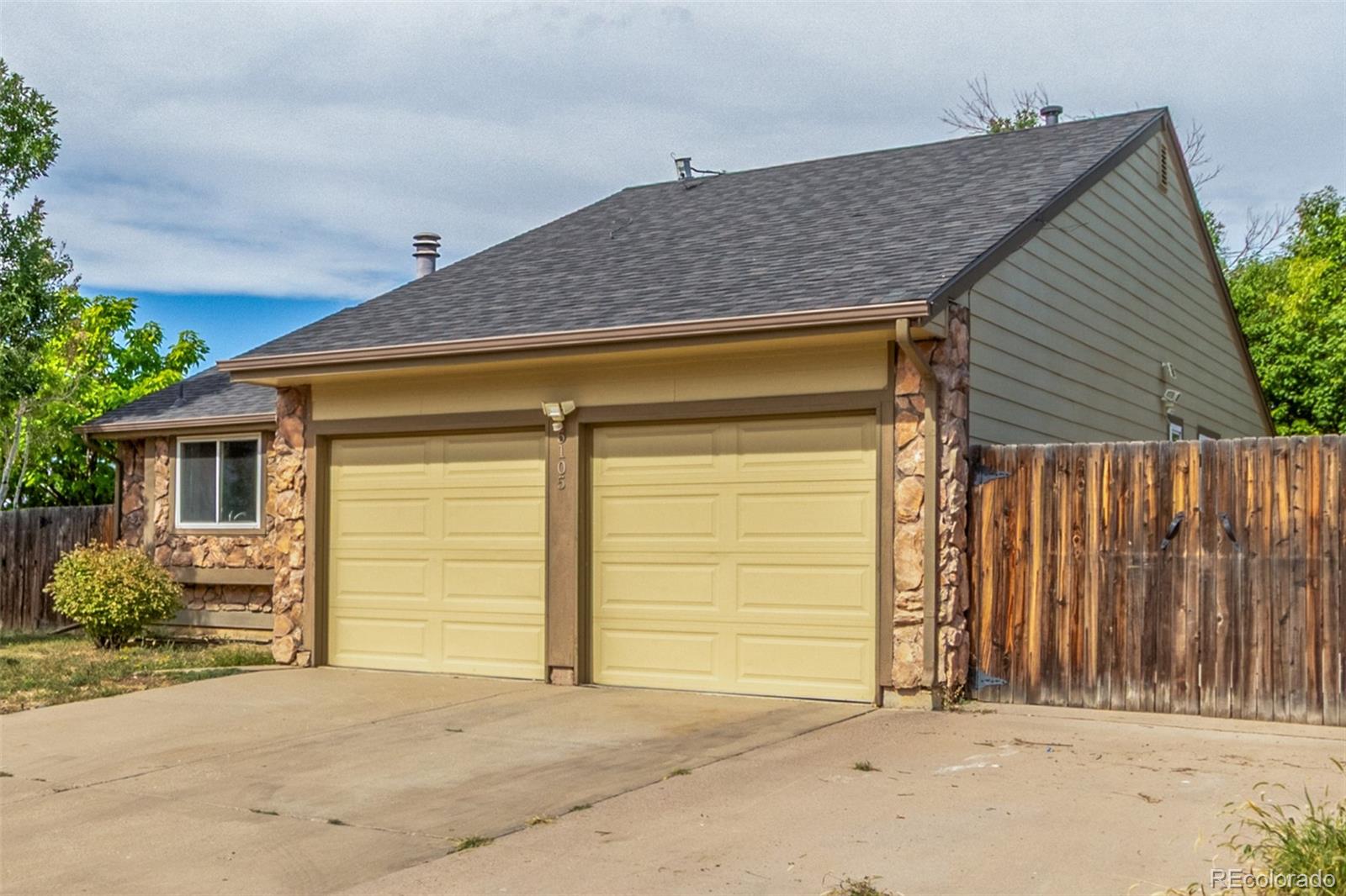 5105 Chandler Way Denver, CO 80239 - Photo 2 of 32 a front view of a house