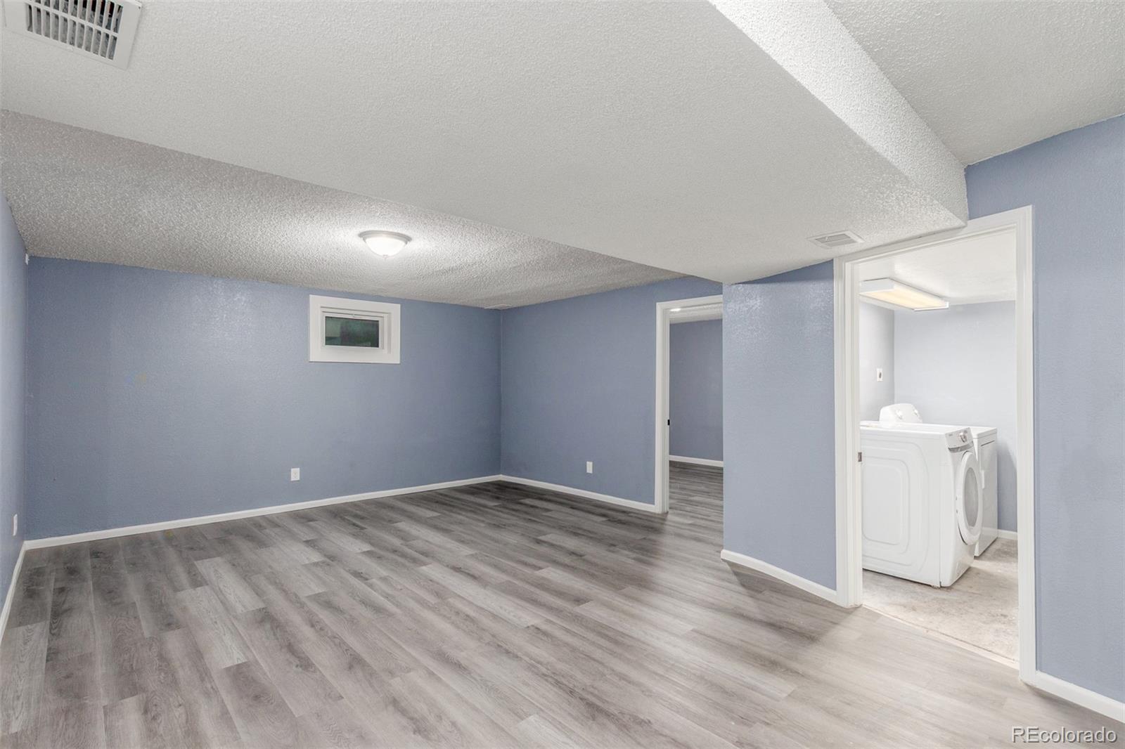 5105 Chandler Way Denver, CO 80239 - Photo 26 of 32 a view of an empty room with bathroom
