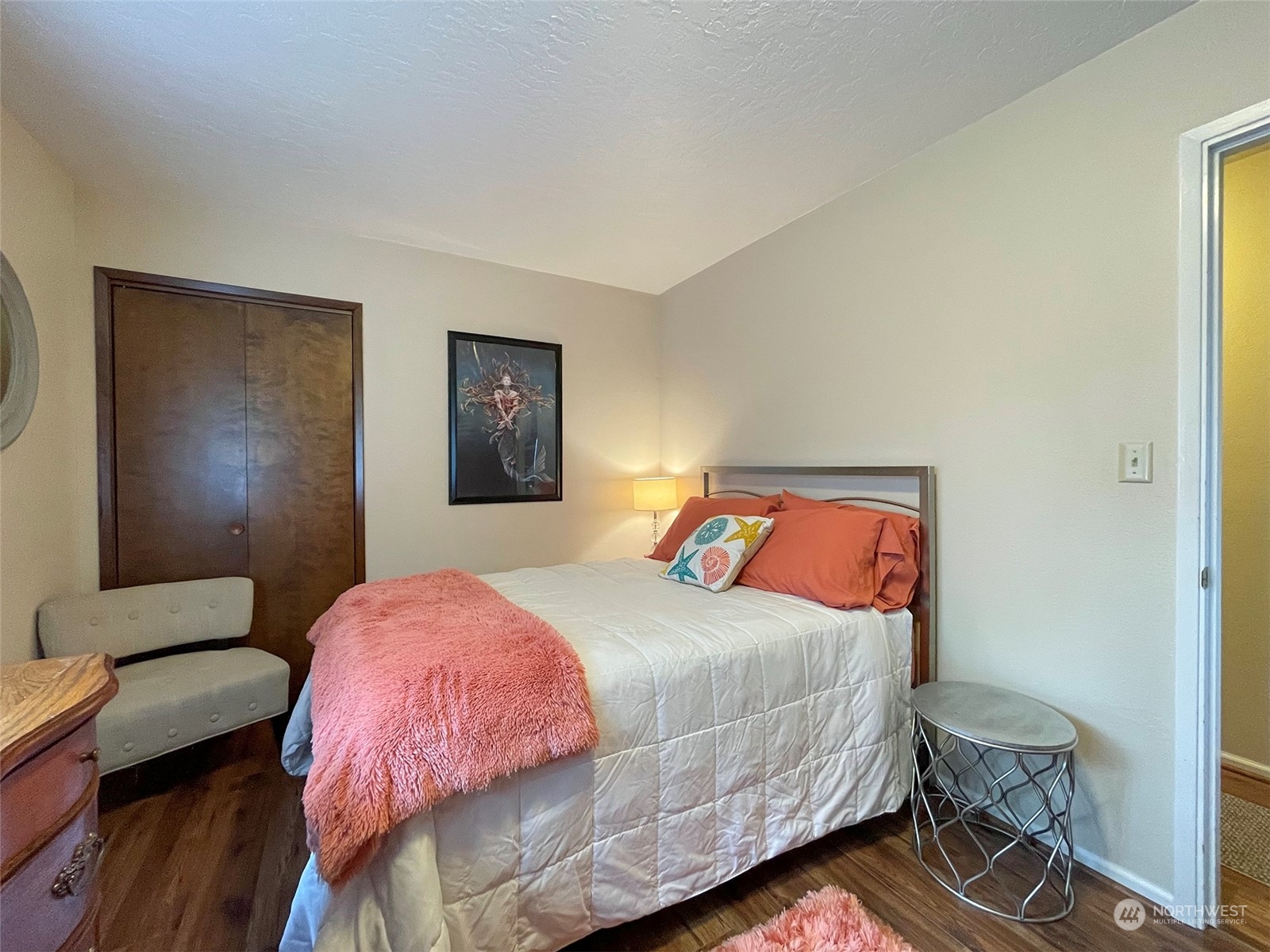 42 Sekiu Airport Road Sekiu, WA 98381 - Photo 12 of 27 a bedroom with a bed and wooden floor