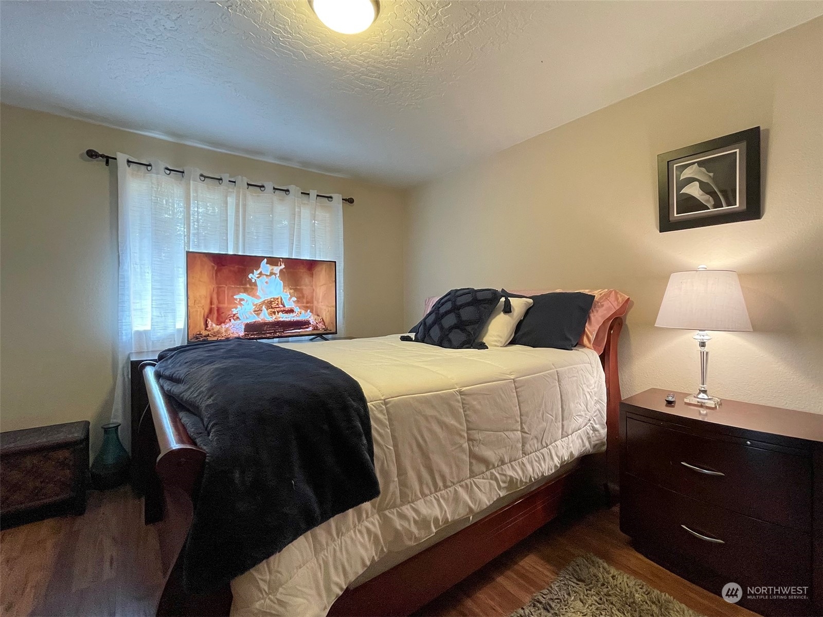 42 Sekiu Airport Road Sekiu, WA 98381 - Photo 14 of 27 a bedroom with a bed and a lamp