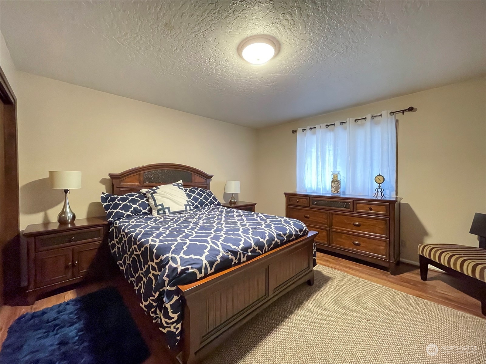 42 Sekiu Airport Road Sekiu, WA 98381 - Photo 15 of 27 a bed room with a bed and a chair