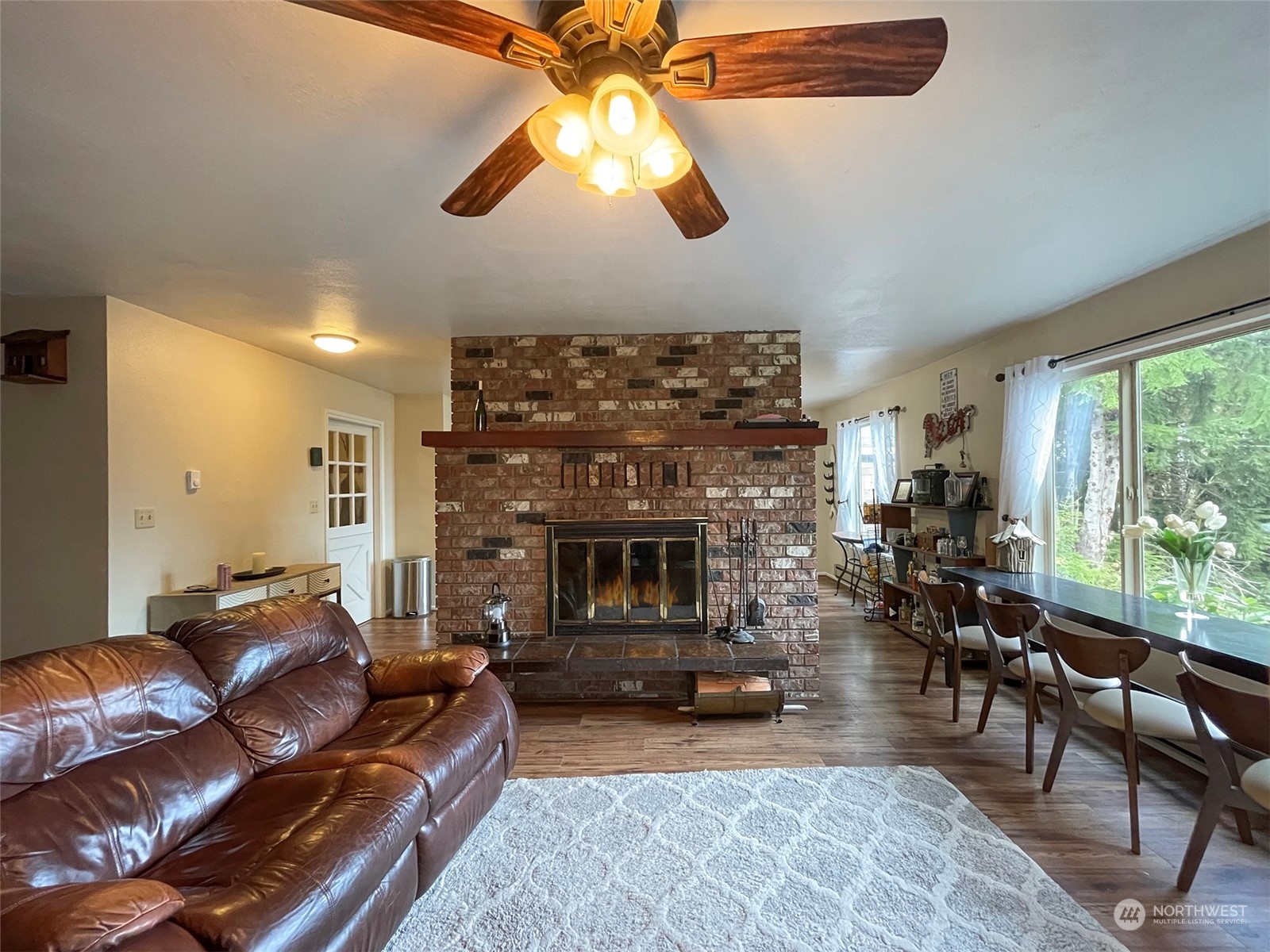42 Sekiu Airport Road Sekiu, WA 98381 - Photo 6 of 27 a living room with furniture a fireplace and a large window