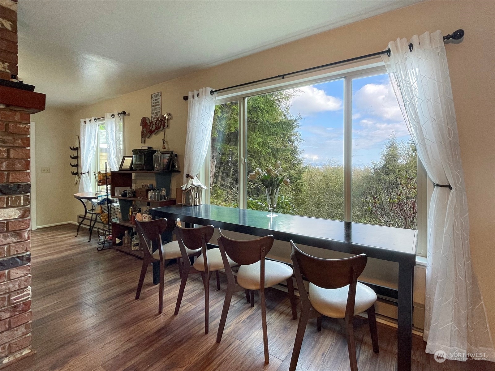42 Sekiu Airport Road Sekiu, WA 98381 - Photo 7 of 27 a dining room with furniture window and wooden floor