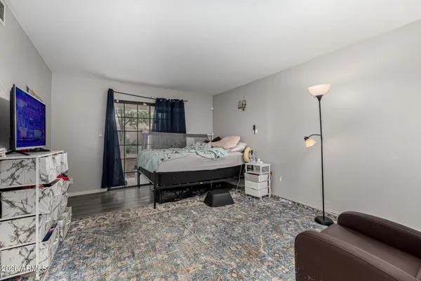 a bedroom with furniture and a window
