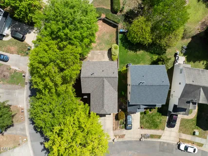 an aerial view of a house with outdoor space