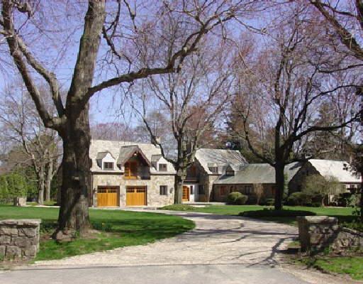 136 West Meadow Road Wilton, CT 06897 - Photo 1 of 1 a view of a white house next to a yard with a tree and plants