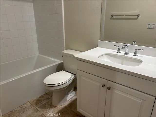 a view of backyard with outdoor seating and green space