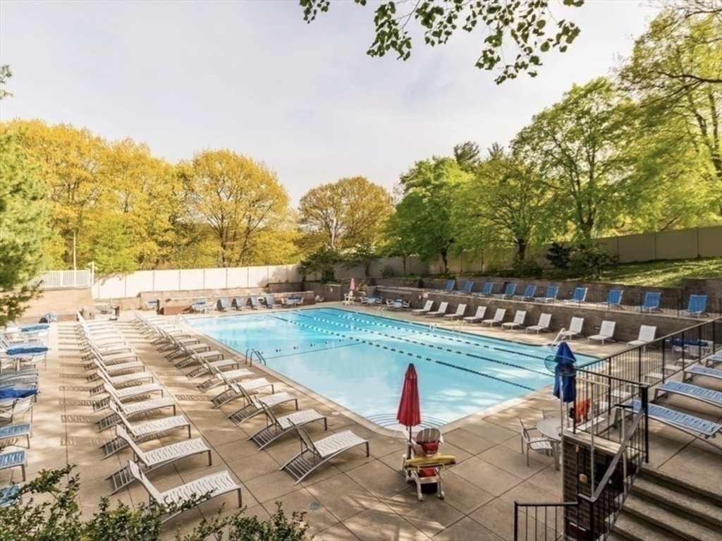 44 Washington Street, Unit 1009 Brookline, MA 02445 - Photo 8 of 12 a view of a swimming pool with a patio