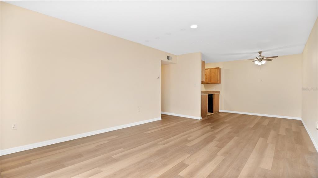 1695 Lee Road, Unit E103 Winter Park, FL 32789 - Photo 5 of 20 wooden floor in an empty room