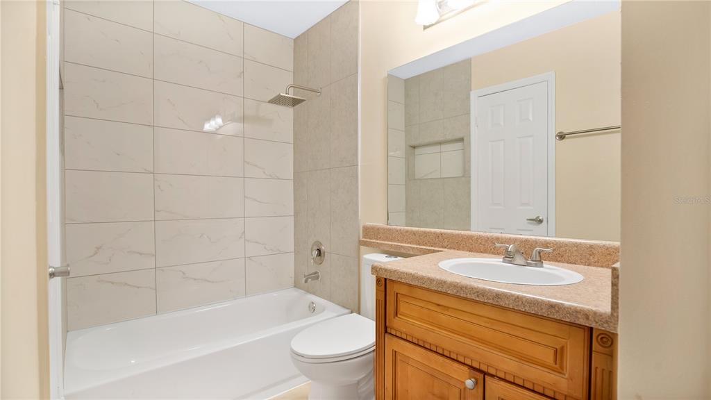 1695 Lee Road, Unit E103 Winter Park, FL 32789 - Photo 9 of 20 a bathroom with a sink toilet and shower
