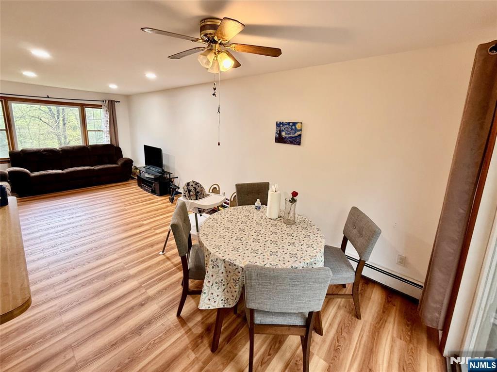 154 Cork Hill Road Franklin, NJ 07416 - Photo 5 of 35 a view of a dining room with furniture and wooden floor