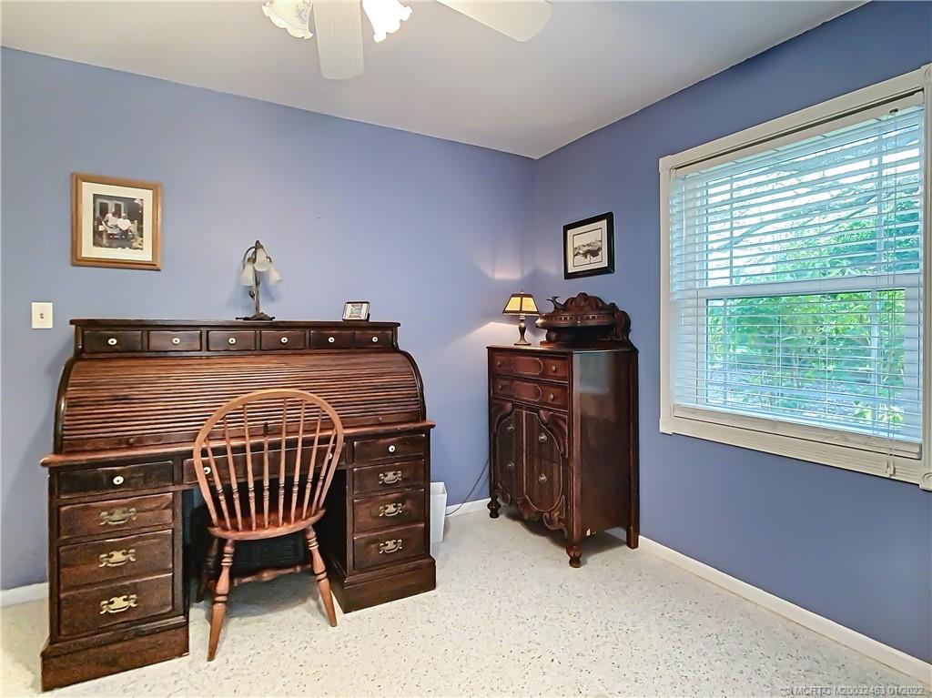 9 Ridgeview Road North Stuart, FL 34996 - Photo 15 of 20 a bedroom with a bed and a window
