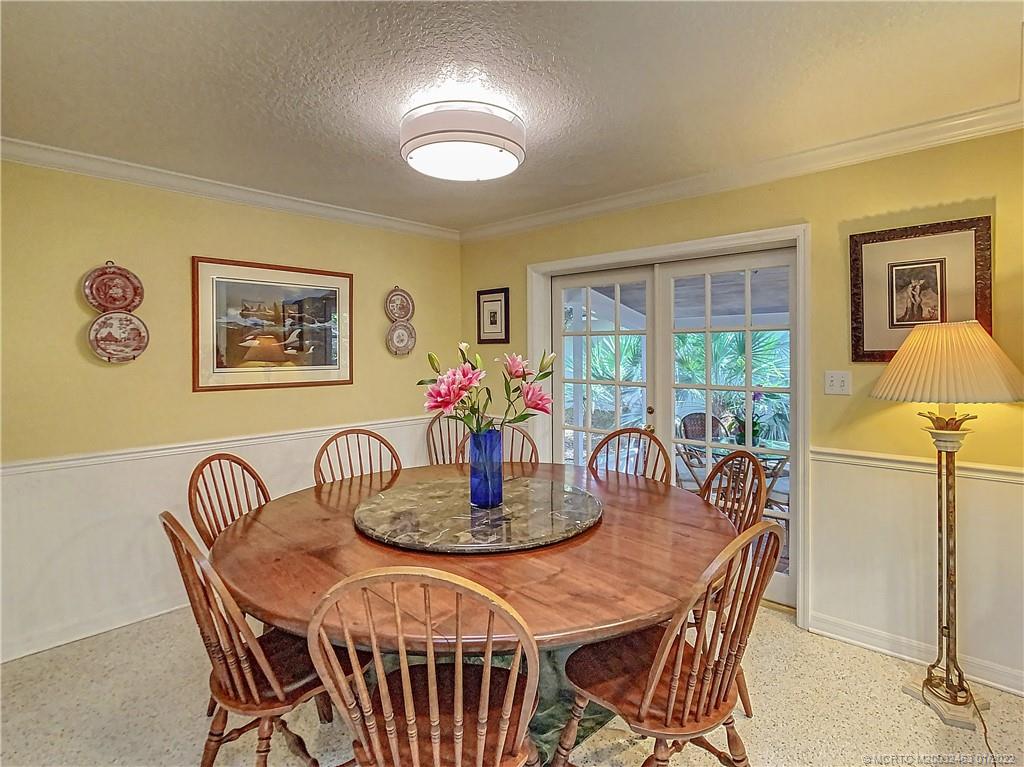 9 Ridgeview Road North Stuart, FL 34996 - Photo 9 of 20 a dining room with furniture and window