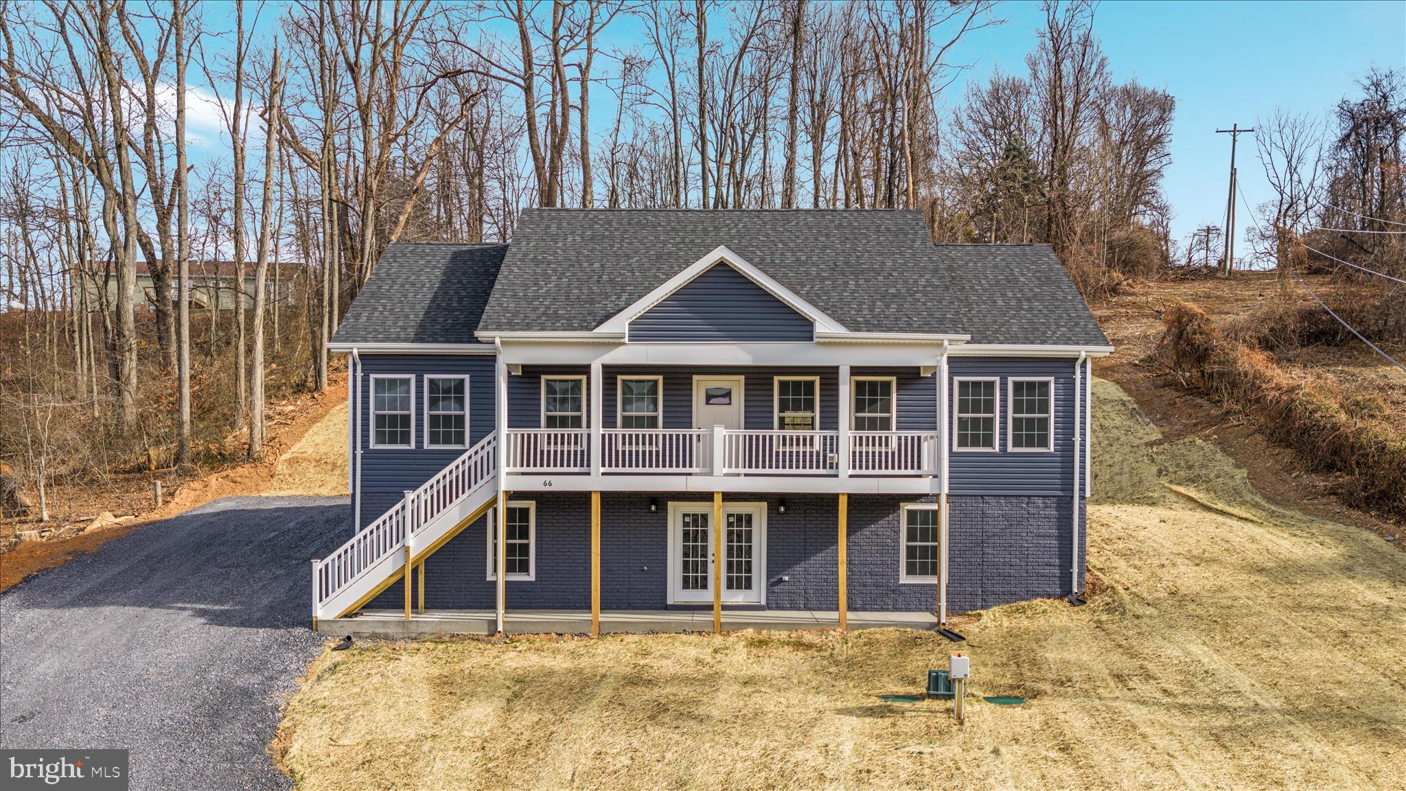 66 Bluejay Court Front Royal, VA 22630 - Photo 11 of 81 a house with tall trees in the background