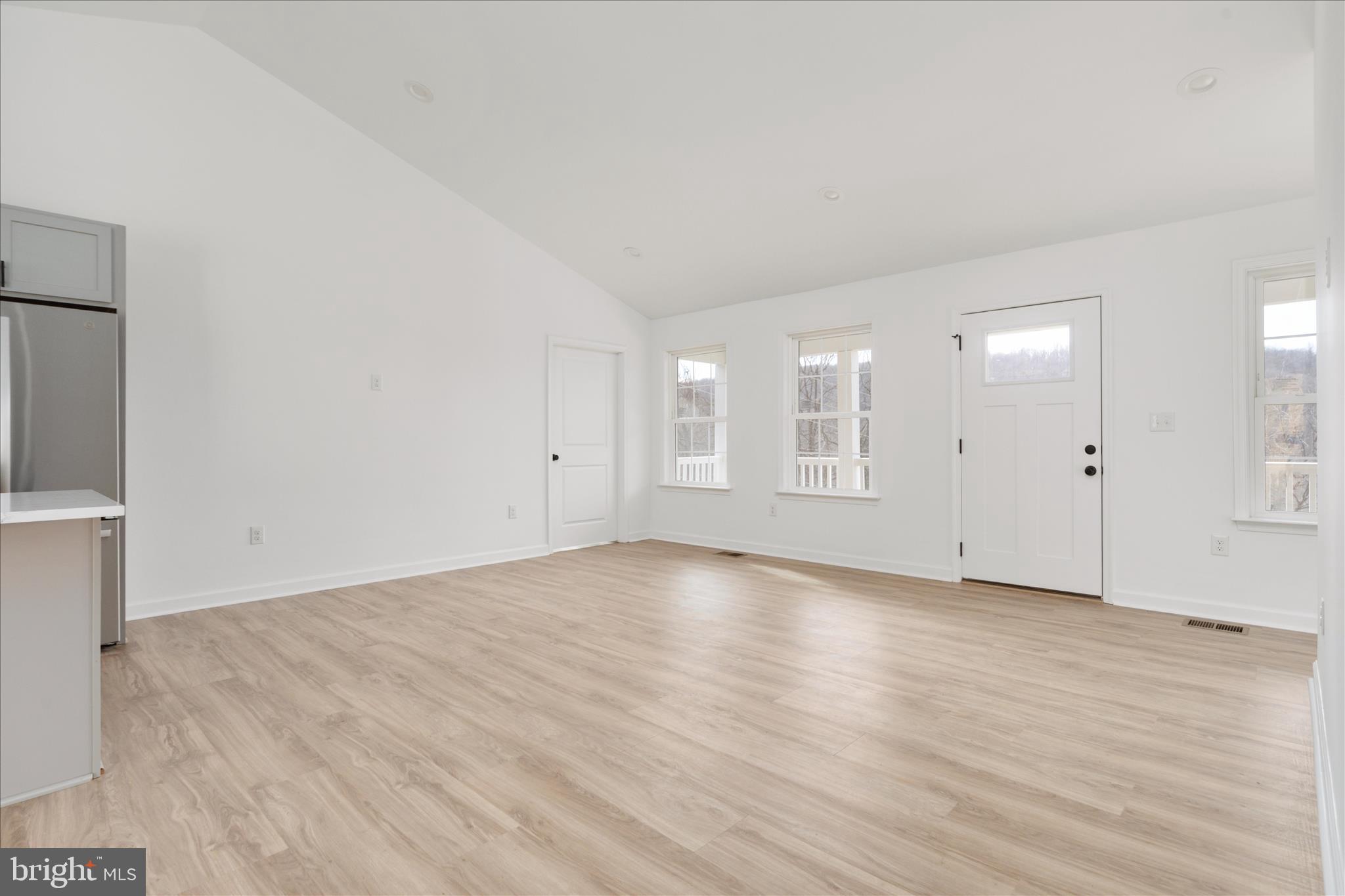 66 Bluejay Court Front Royal, VA 22630 - Photo 15 of 81 an empty room with wooden floor and windows
