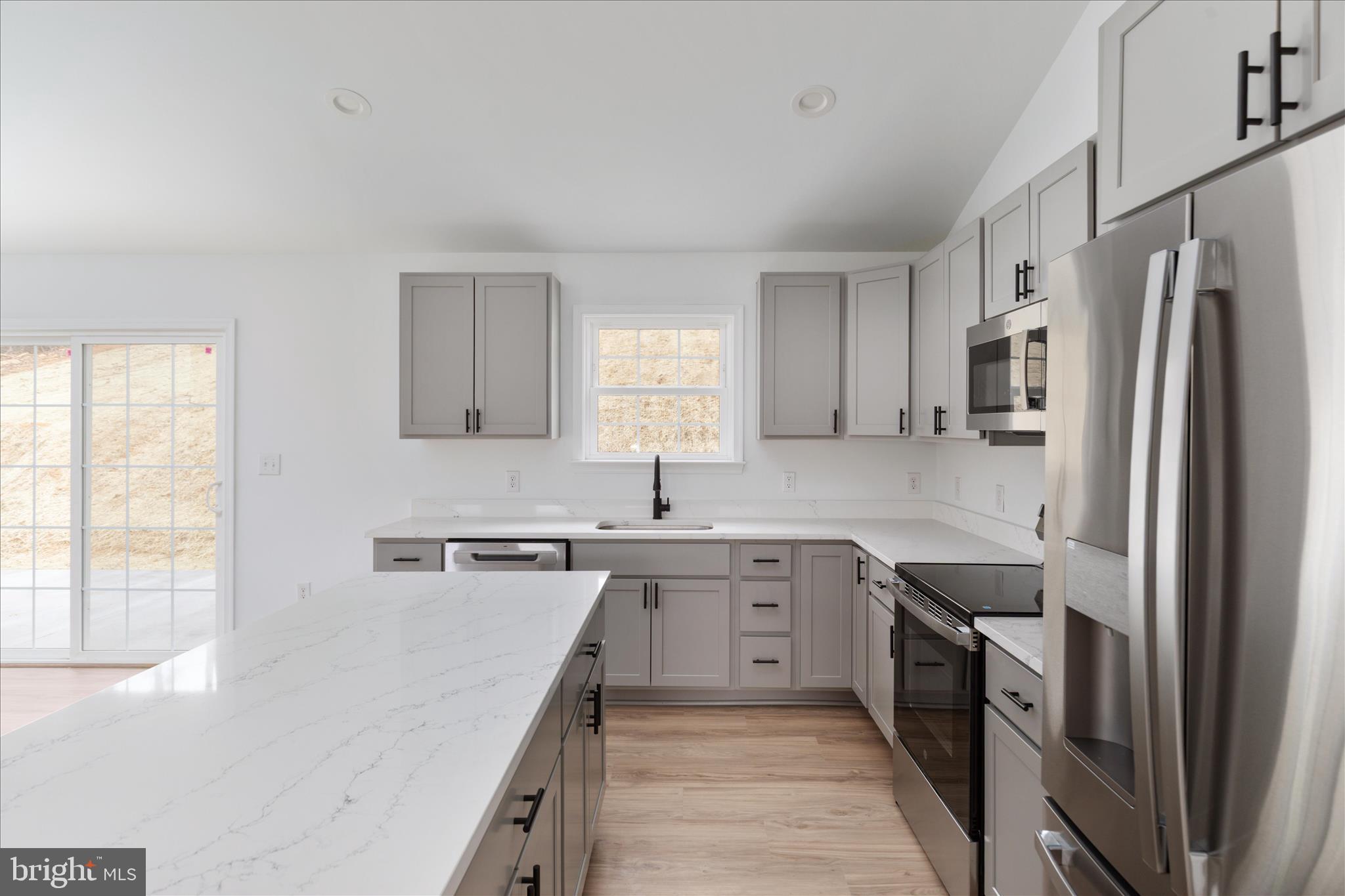66 Bluejay Court Front Royal, VA 22630 - Photo 21 of 81 a kitchen with a sink stove refrigerator and cabinets