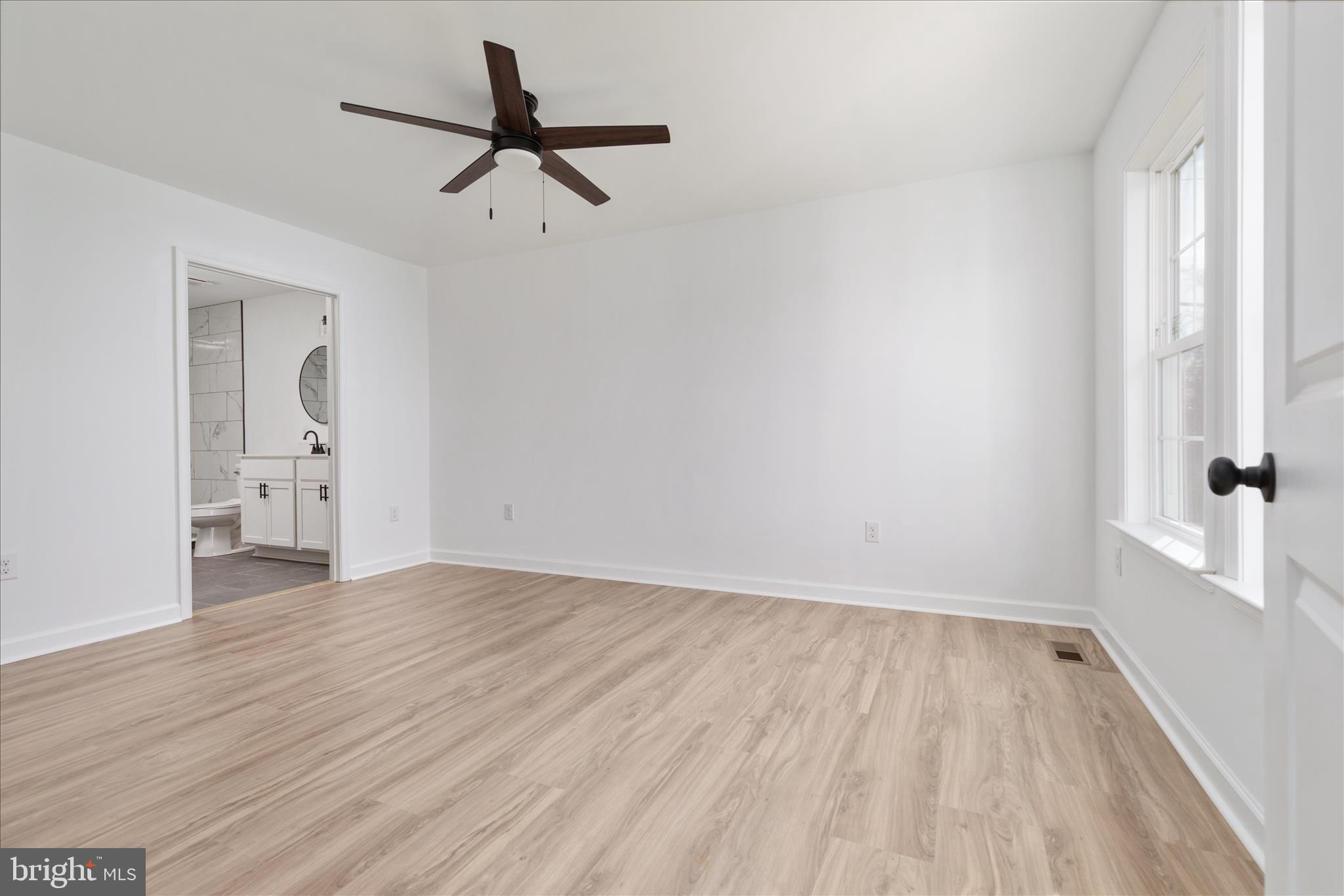 66 Bluejay Court Front Royal, VA 22630 - Photo 24 of 81 a view of empty room with wooden floor and fan