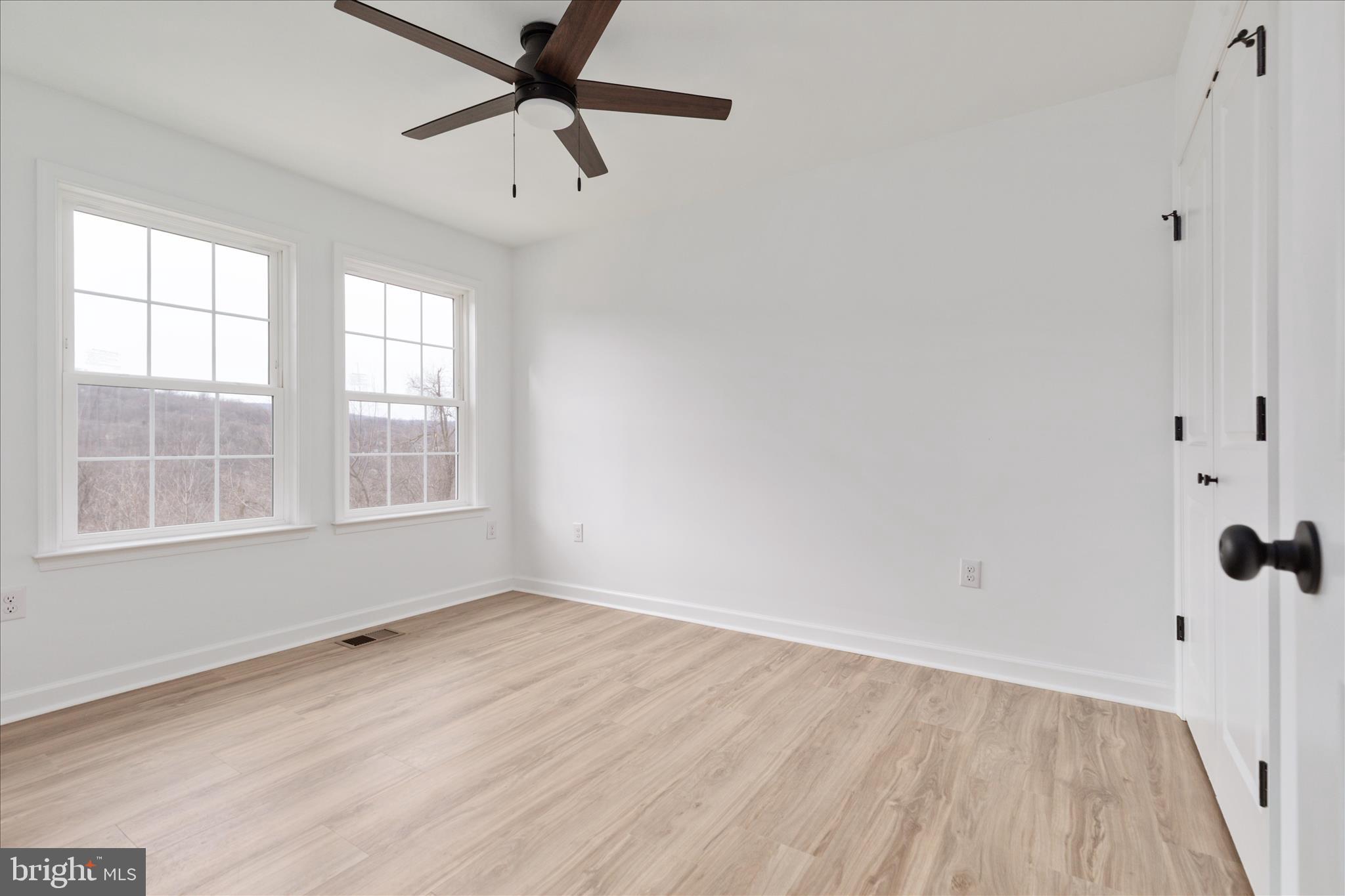 66 Bluejay Court Front Royal, VA 22630 - Photo 32 of 81 wooden floor in an empty room with a window