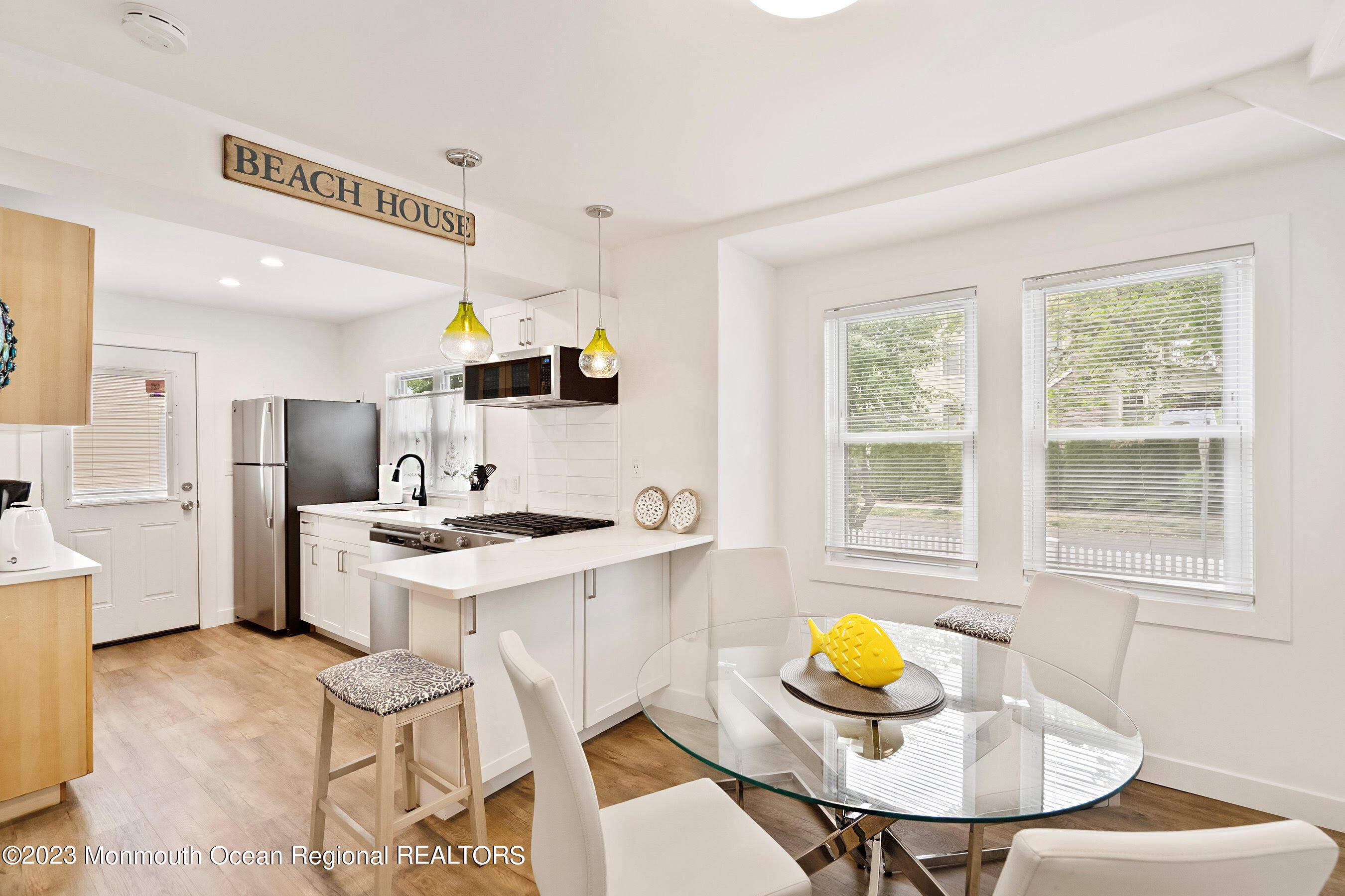 1401 B Street, Unit DOWNSTAIRS Belmar, NJ 07719 - Photo 2 of 12 a view of a dining room with furniture and a window
