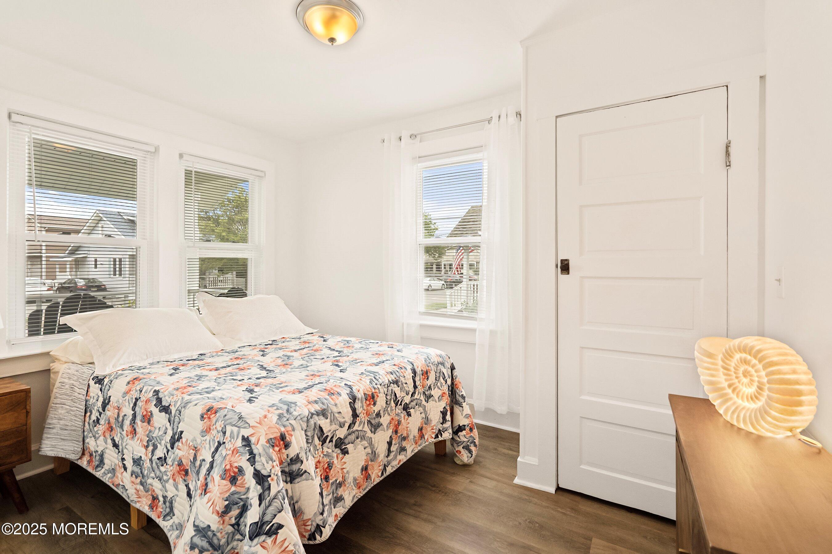 1401 B Street, Unit DOWNSTAIRS Belmar, NJ 07719 - Photo 10 of 12 a bedroom with a bed and a window