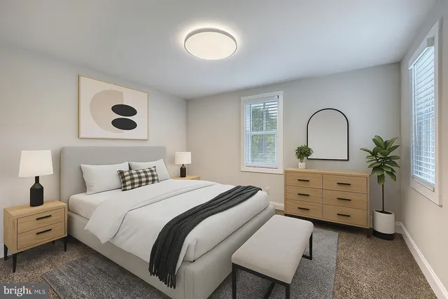 a bedroom with a bed and a dresser