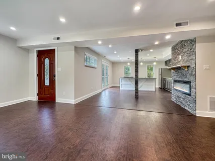 a bathroom with a tub a sink and a shower