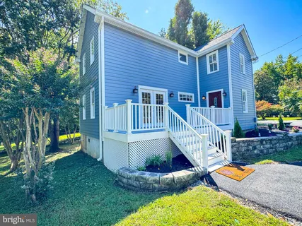 a kitchen with stainless steel appliances granite countertop a stove a refrigerator and a sink