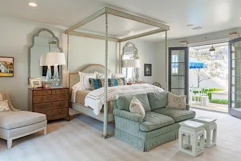 a bedroom with bed and window