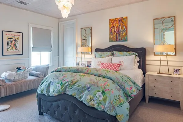 a bedroom with a bed and window