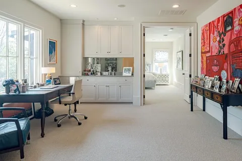 a workspace with furniture and window