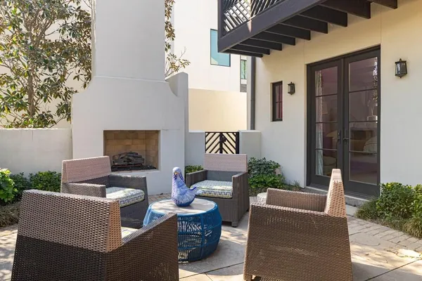 a outdoor living space with patio furniture and a fireplace