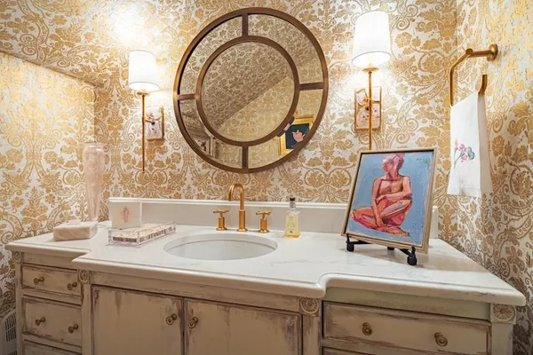 a bathroom with a sink and a mirror