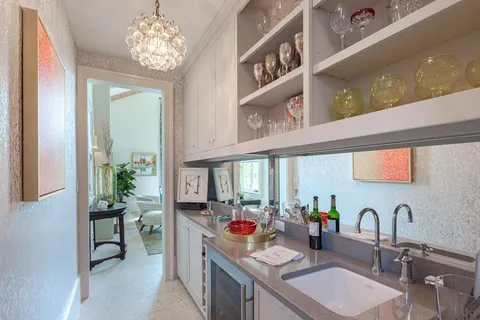 a kitchen with a sink and a stove top oven