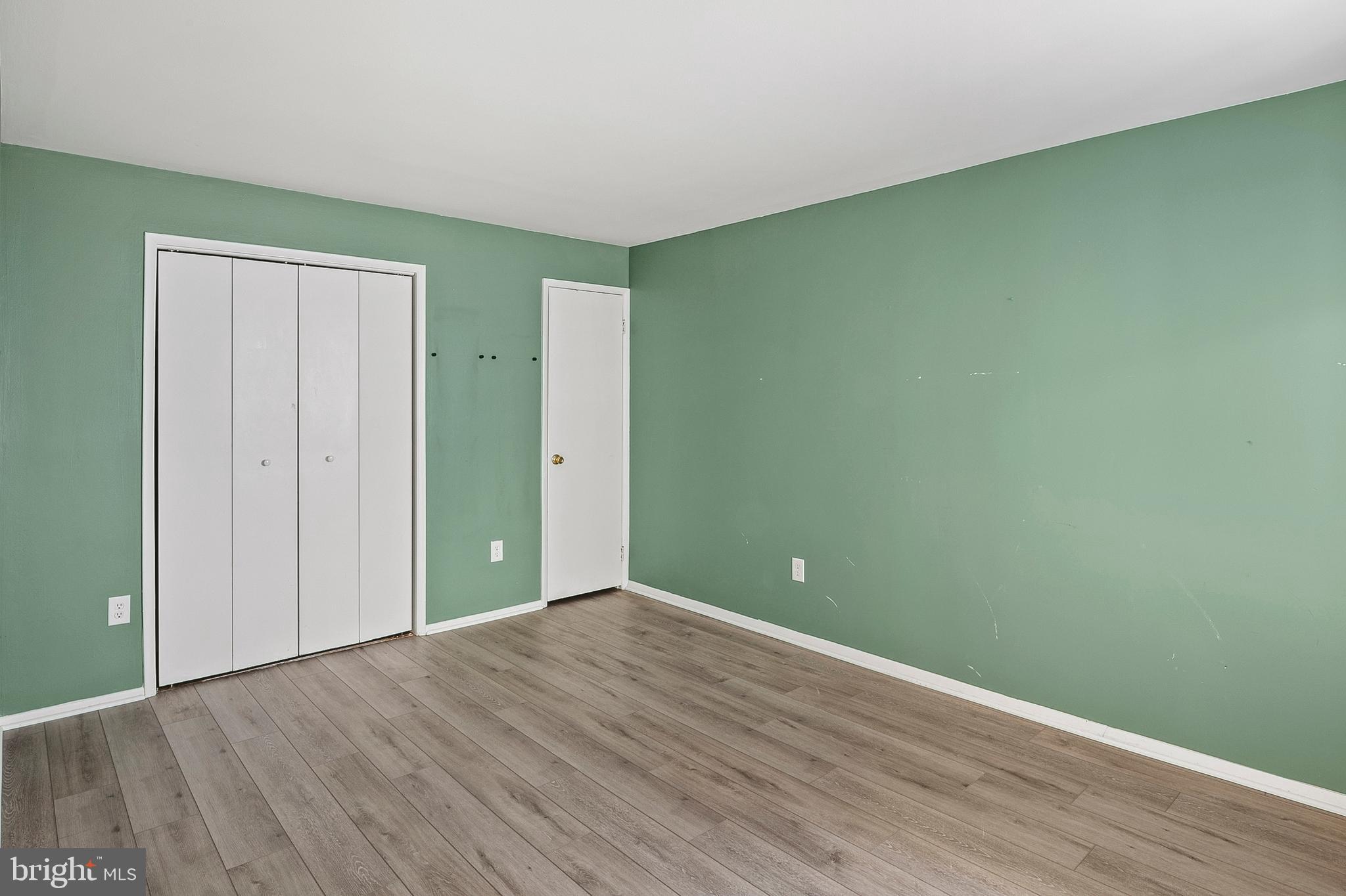 1619 Fendall Court Crofton, MD 21114 - Photo 12 of 21 a view of empty room with wooden floor