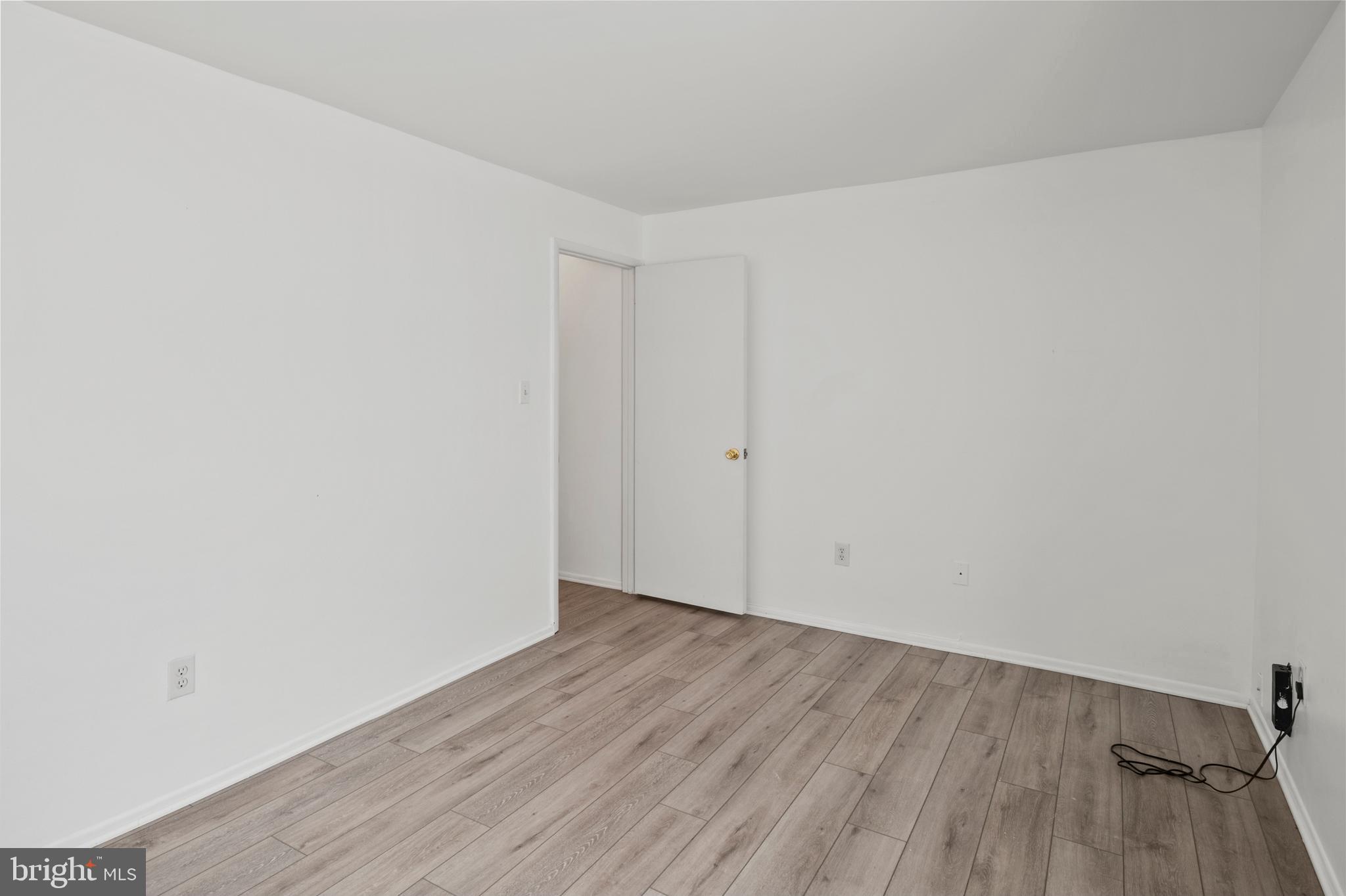 1619 Fendall Court Crofton, MD 21114 - Photo 17 of 21 a view of an empty room with wooden floor