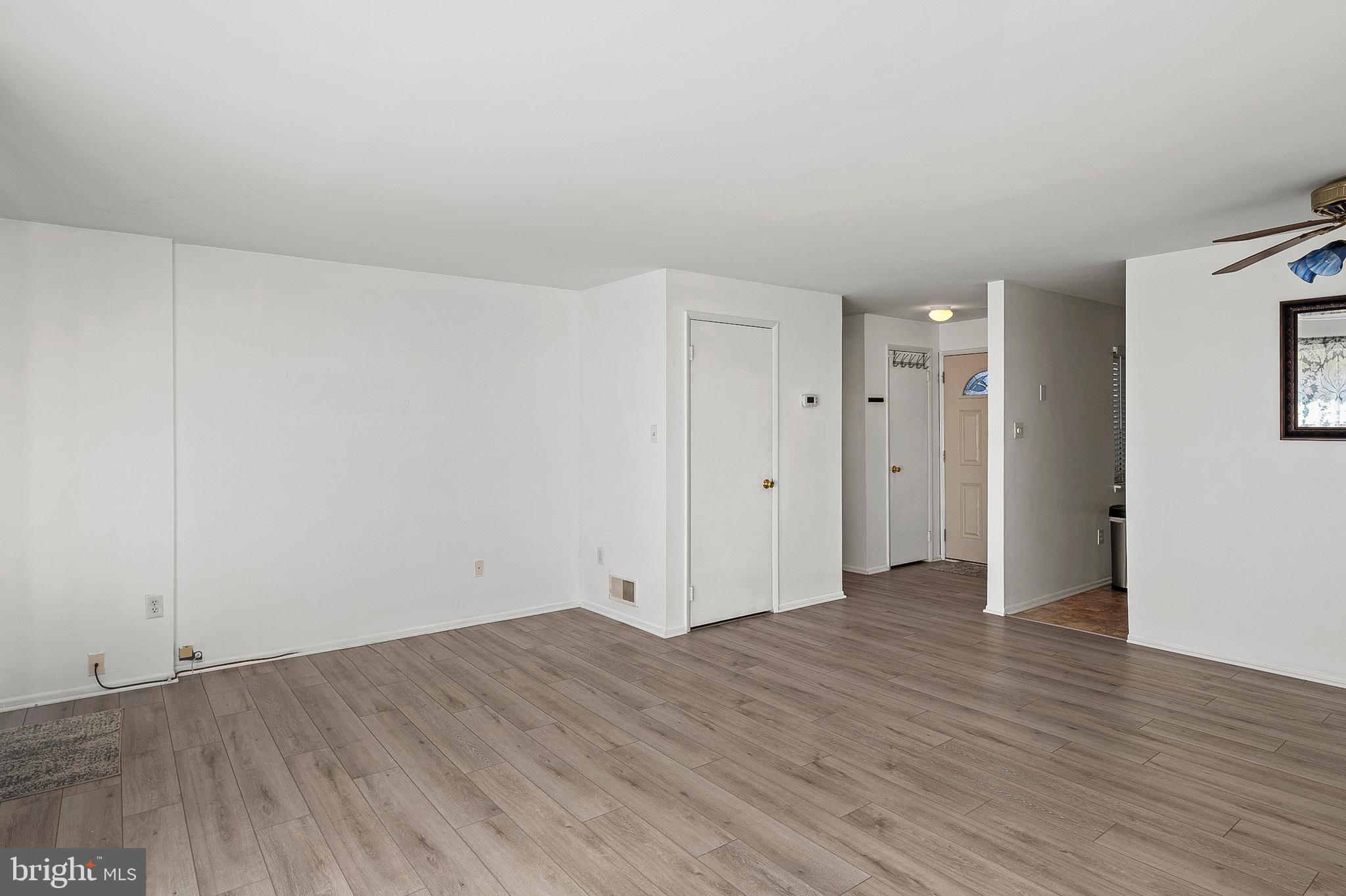 1619 Fendall Court Crofton, MD 21114 - Photo 5 of 21 a view of an empty room with wooden floor