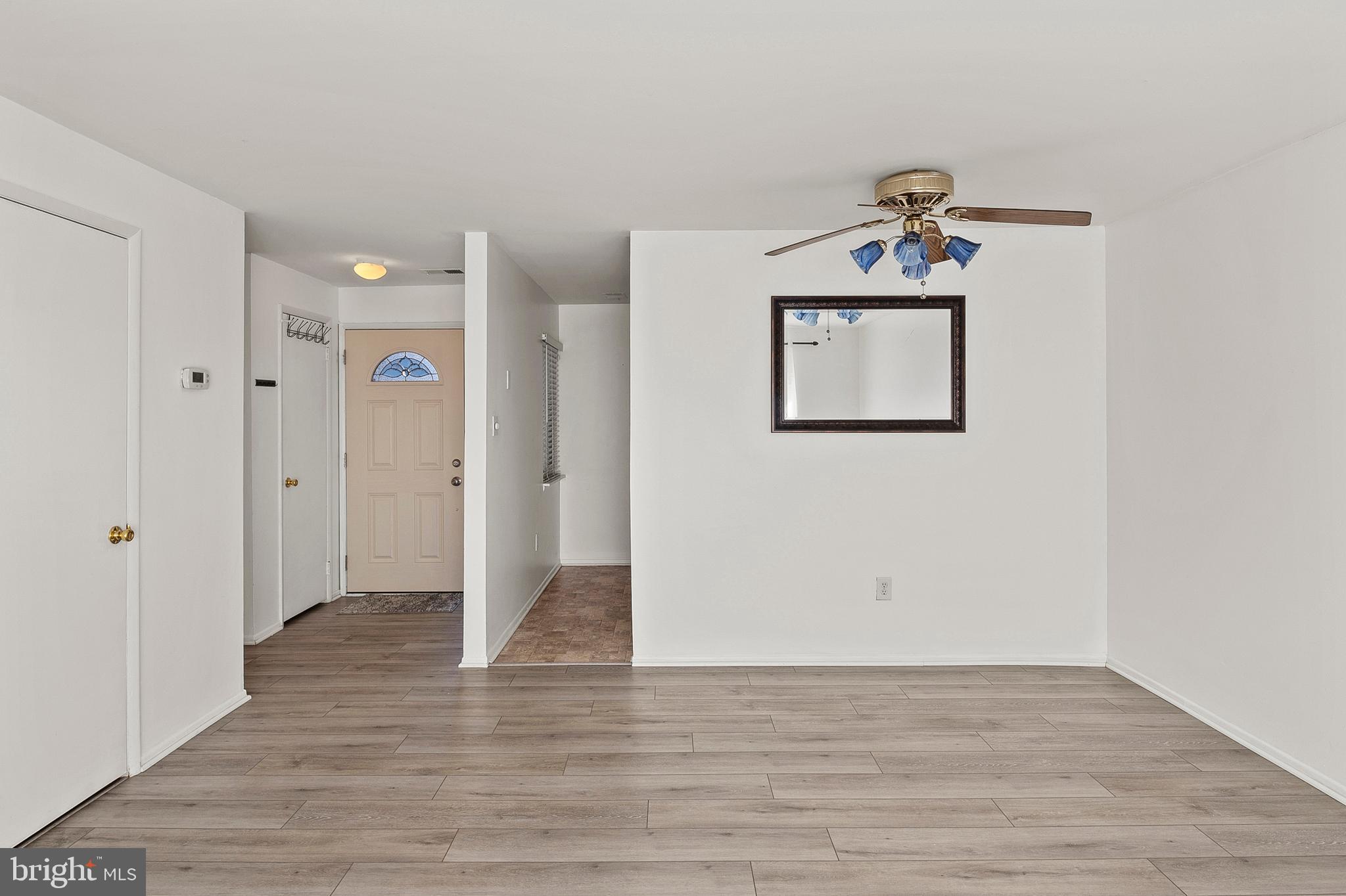 1619 Fendall Court Crofton, MD 21114 - Photo 8 of 21 a view of a hallway with wooden floor and closet