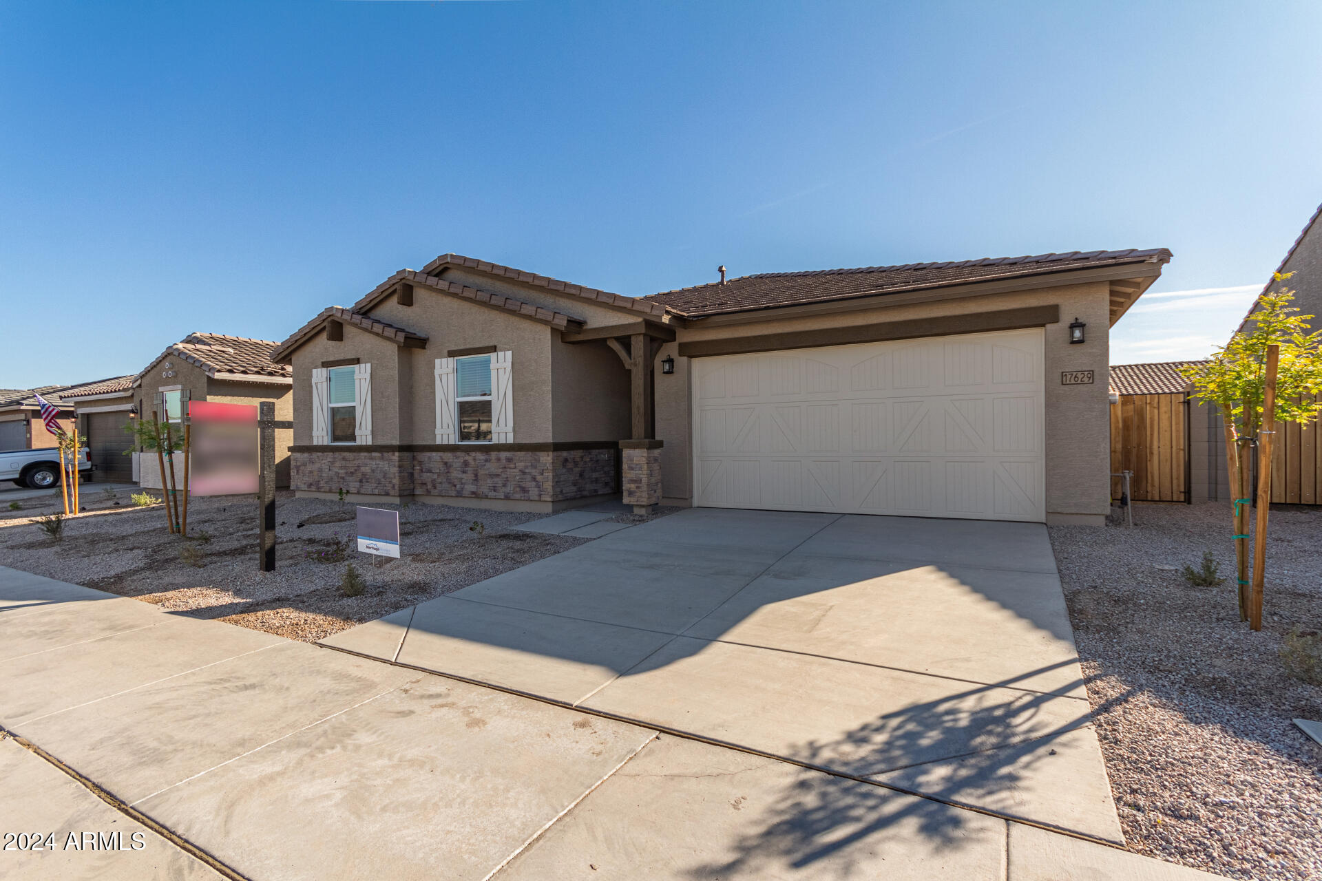 17629 West Madison Street Goodyear, AZ 85338 - Photo 3 of 46 a front view of a house with a garage