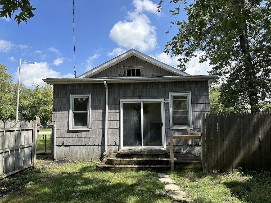 3118 Chicago Road Steger, IL 60475 - Photo 13 of 14 a front view of a house with a yard