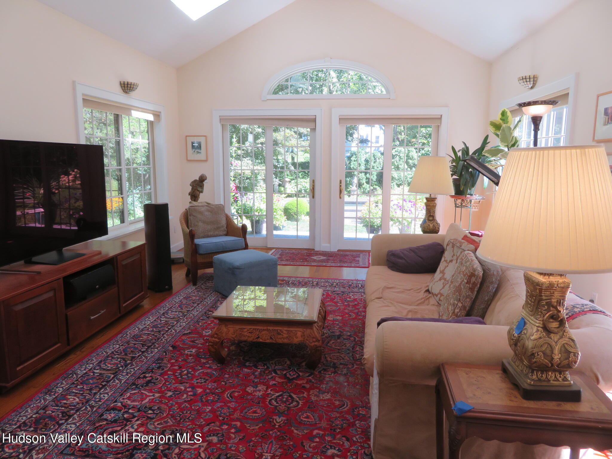 856 Elting Road Rosendale, NY 12472 - Photo 12 of 84 a living room with furniture a flat screen tv and a large window