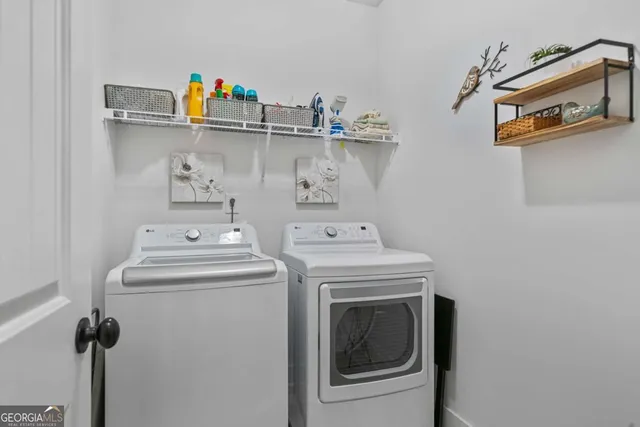 a utility room with dryer and washer