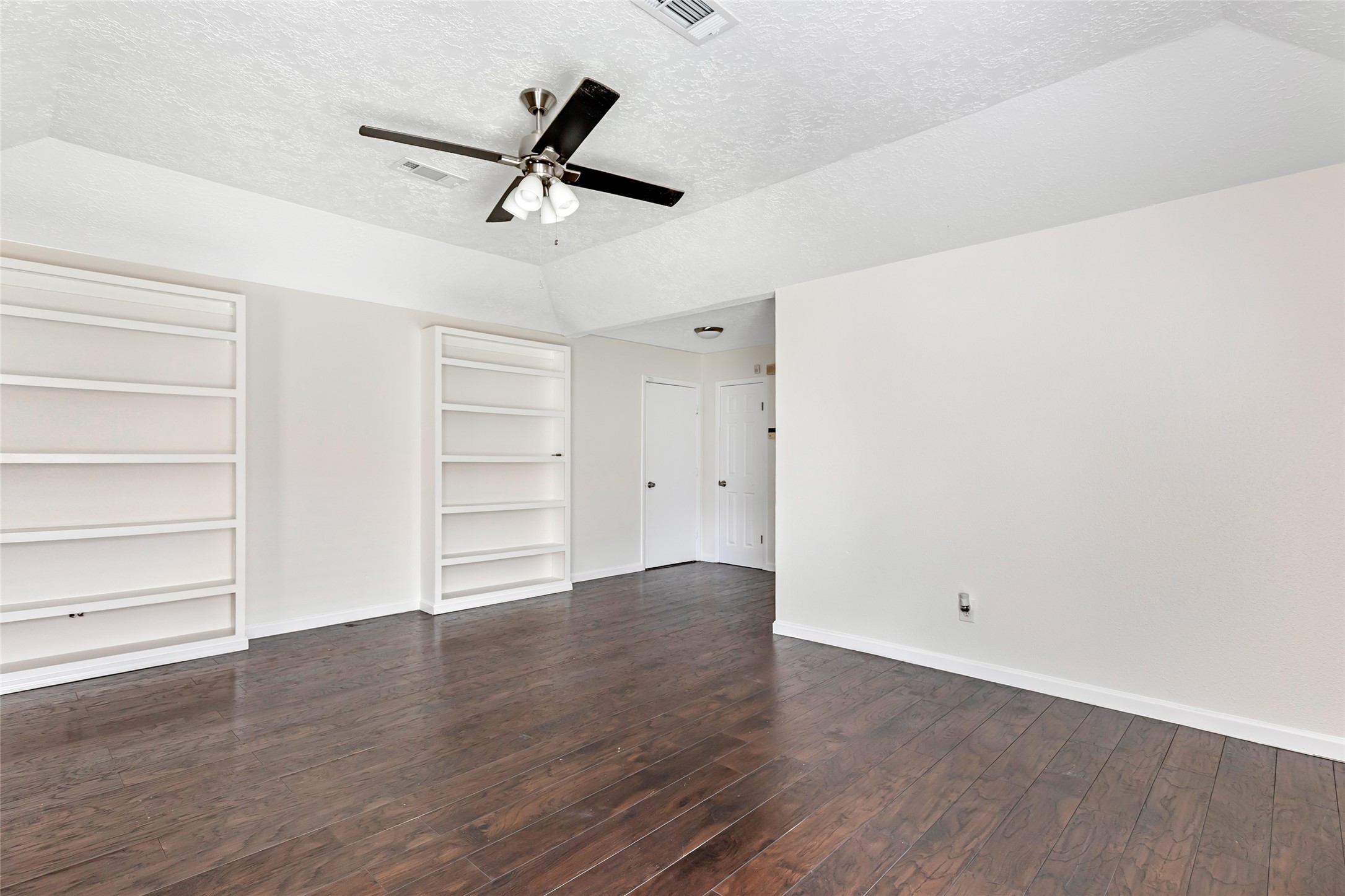 2810 Spring Dusk Drive Spring, TX 77373 - Photo 12 of 30 a view of an empty room with a window and wooden floor