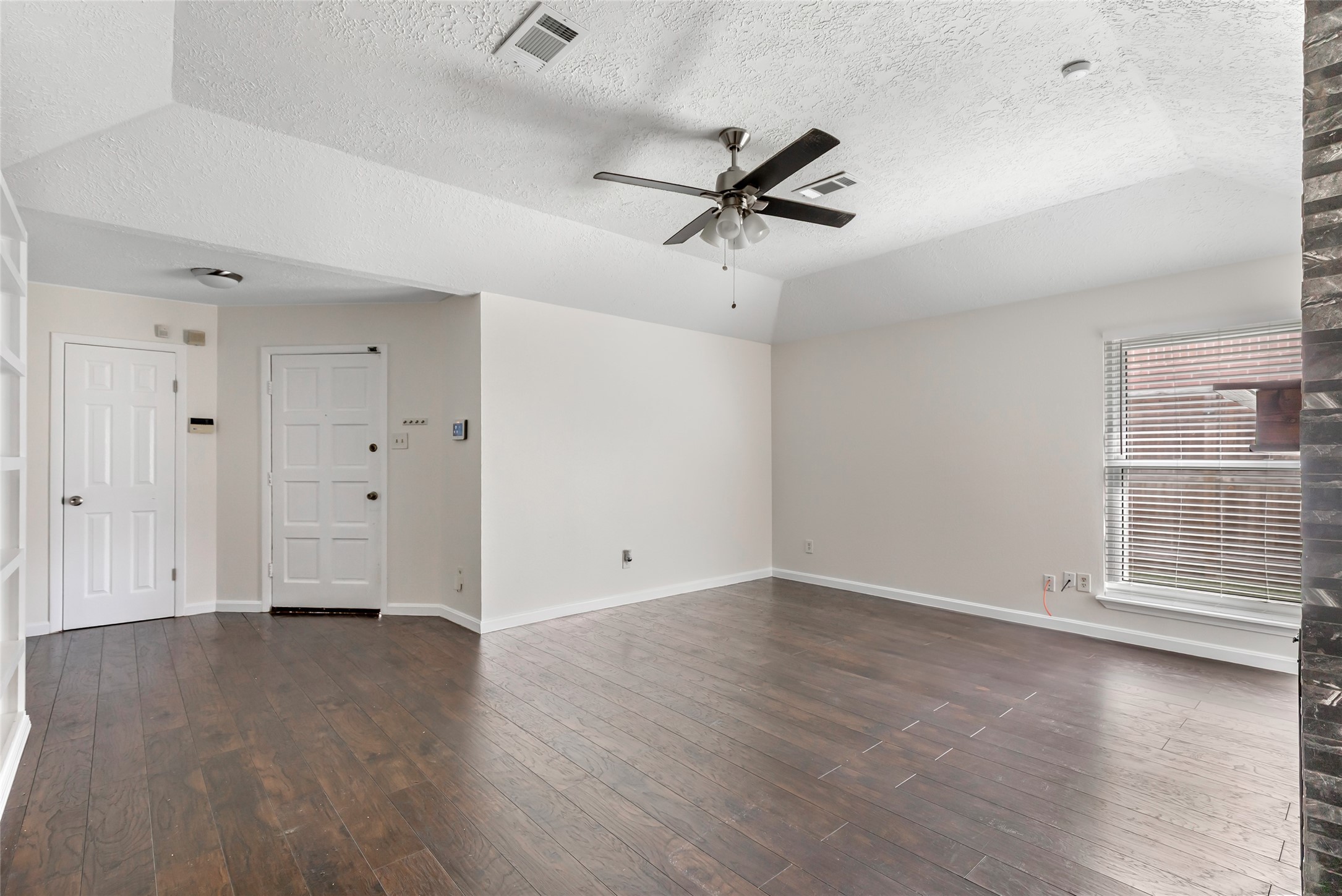 2810 Spring Dusk Drive Spring, TX 77373 - Photo 14 of 30 wooden floor in an empty room with a window
